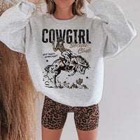 Ash sweatshirt worn with biker shorts — casual cowgirl crewneck style for women