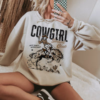 Model wearing Cowgirl Social Club crewneck in sand — women’s western graphic sweatshirt
