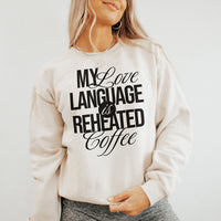 Model in the My Love Language Is Reheated Coffee sweatshirt in heather dust paired with cozy lounge pants — soft, relaxed, and perfect for WFH days.