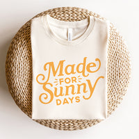 Flat lay of Made for Sunny Days tee — citrus print graphic t-shirt in natural color