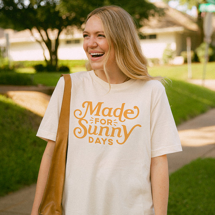 Model wearing Made for Sunny Days tee in natural — citrus graphic summer shirt for women