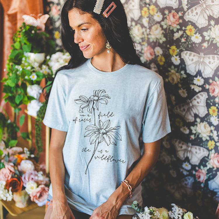 In A Field Of Roses She Is A Wildflower Tee (Wholesale)